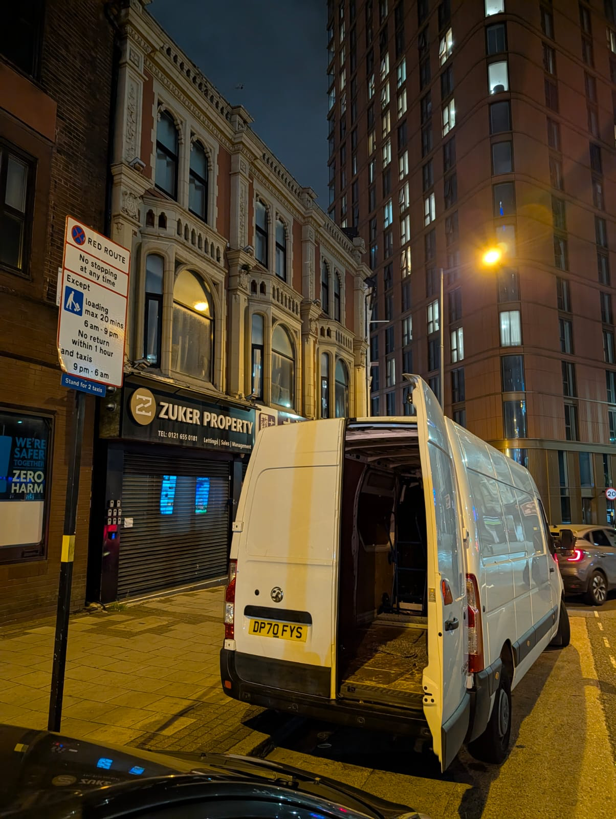 Professional movers securing boxes in a van